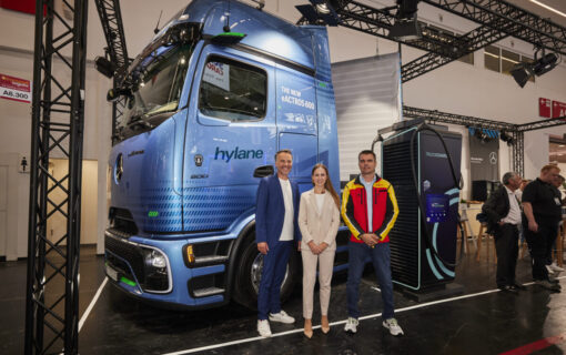 Daimler, DHL, and hylane representatives with one of the new trucks.